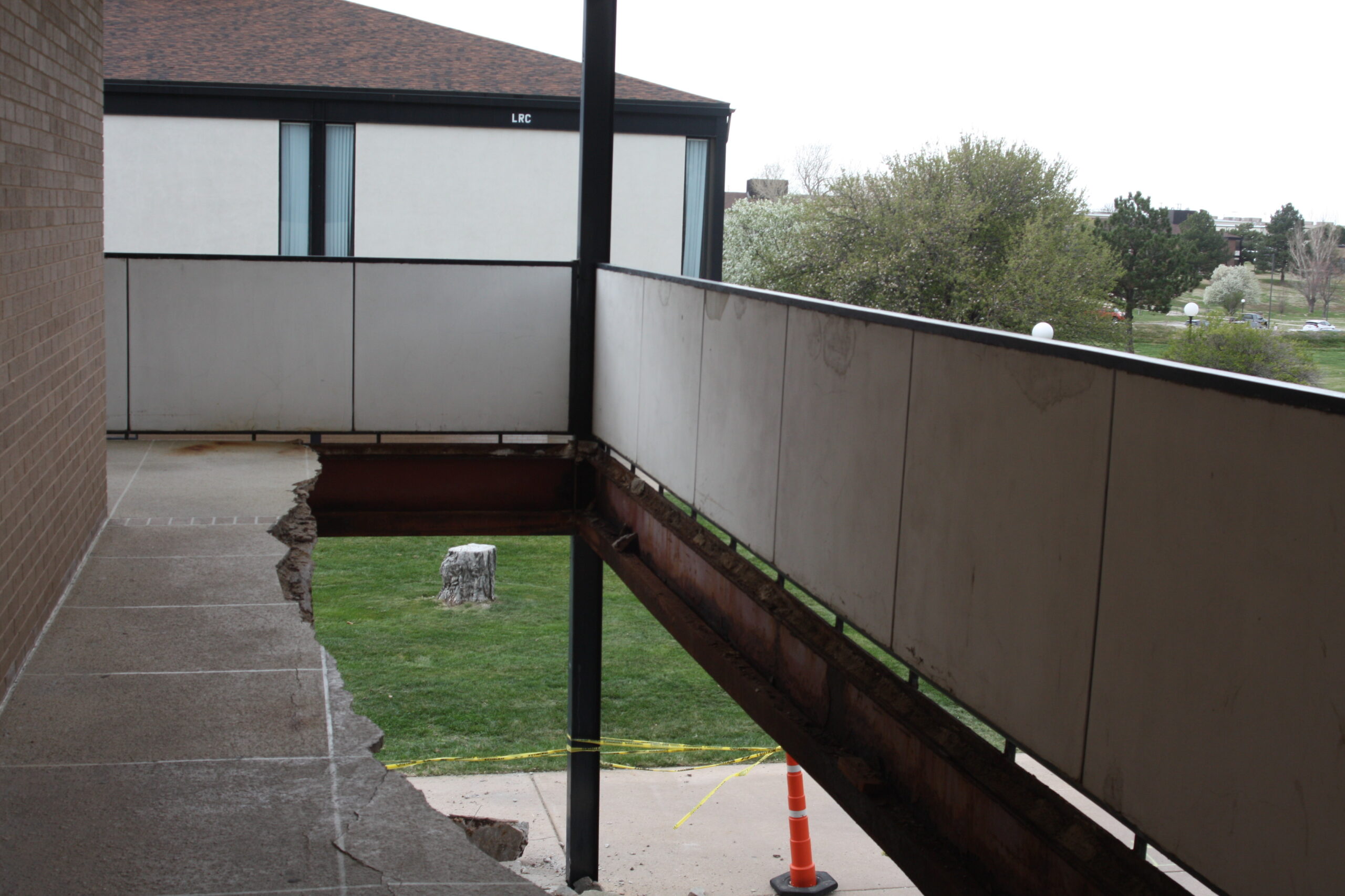 On April 14, after decades of corrosion, the northeast end of the Humanities balcony finally collapsed. [Photo by Lance Ziesch]