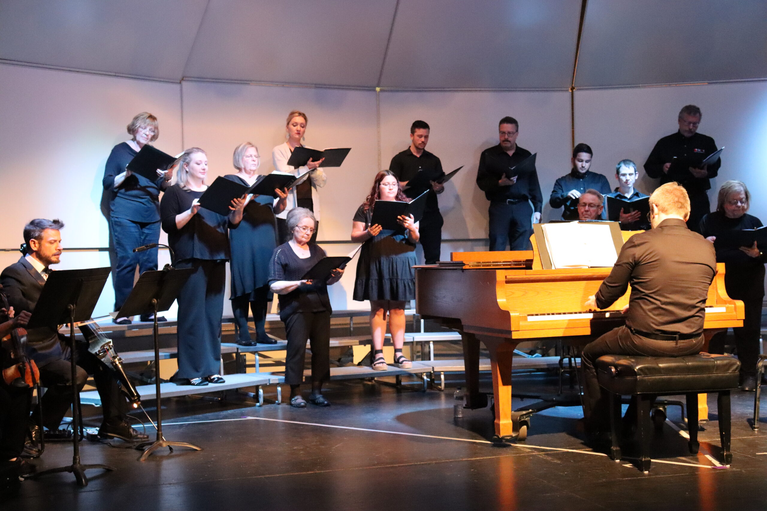 The Dodge City Community College (DC3) Music Department presented its first concert of the school year at 7 p.m., on Thursday, Oct. 7, in the DC3 Little Theatre. The Fall Choral Concert, which was conducted by Kerry Kuplic, DC3 Associate Professor of Vocal Music, included selections by the DC3 Concert Choir and Choral Union—and also featured vocal solos by DC3 students. [Photo by Luke Fay]