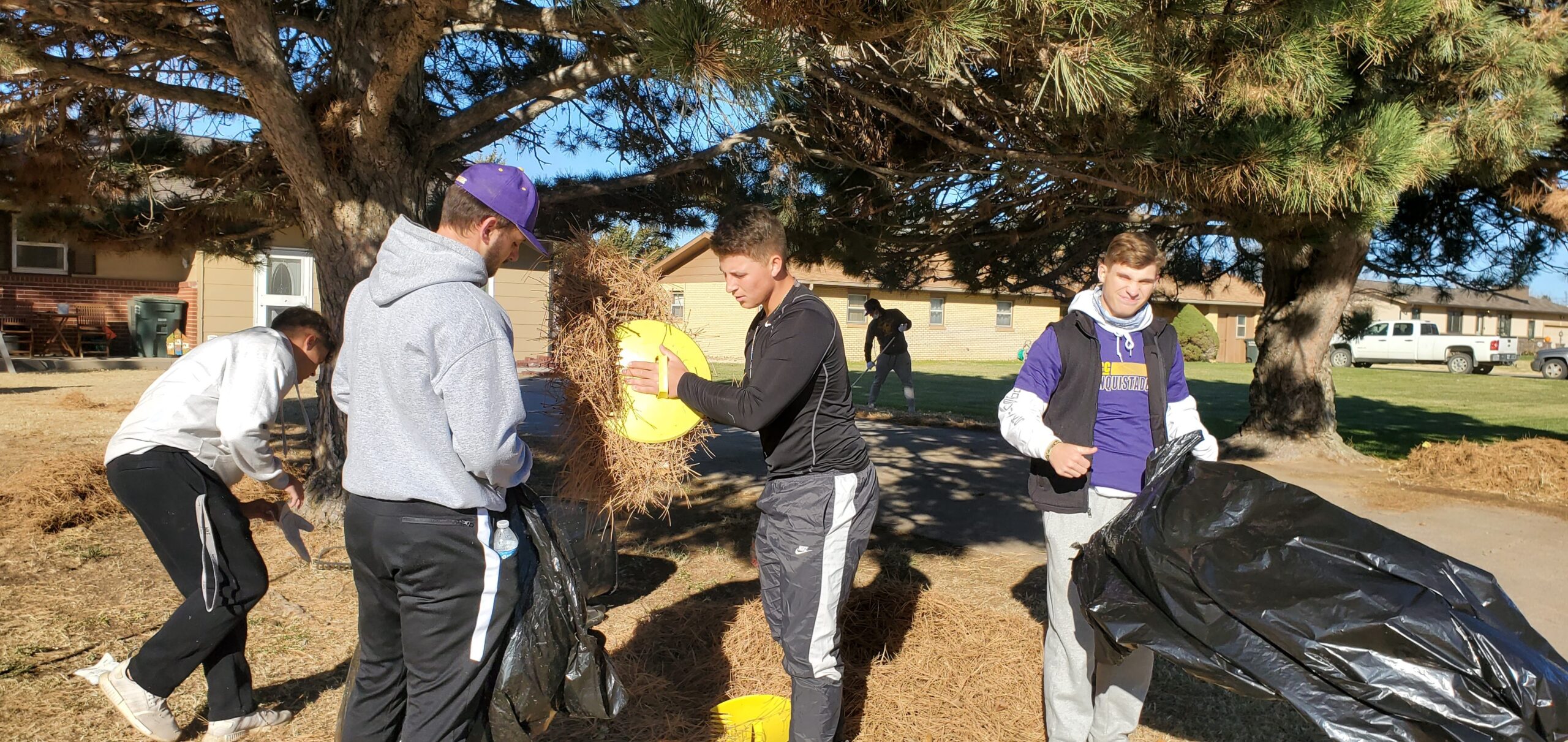 DC3 Baseball team bagging yard waste during the RSVP Annual Clean-Up Day