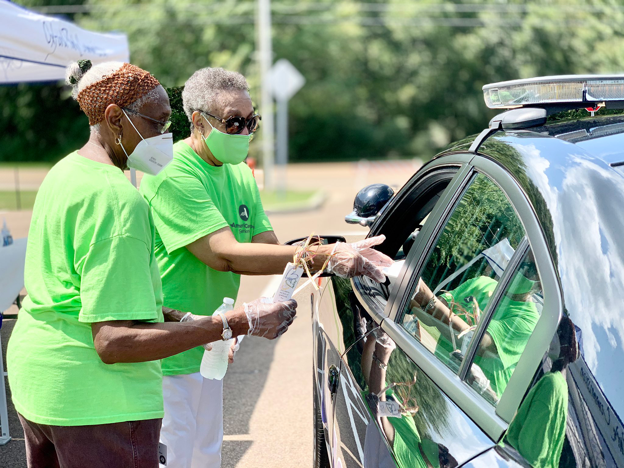 Seniors handing out water and supplies