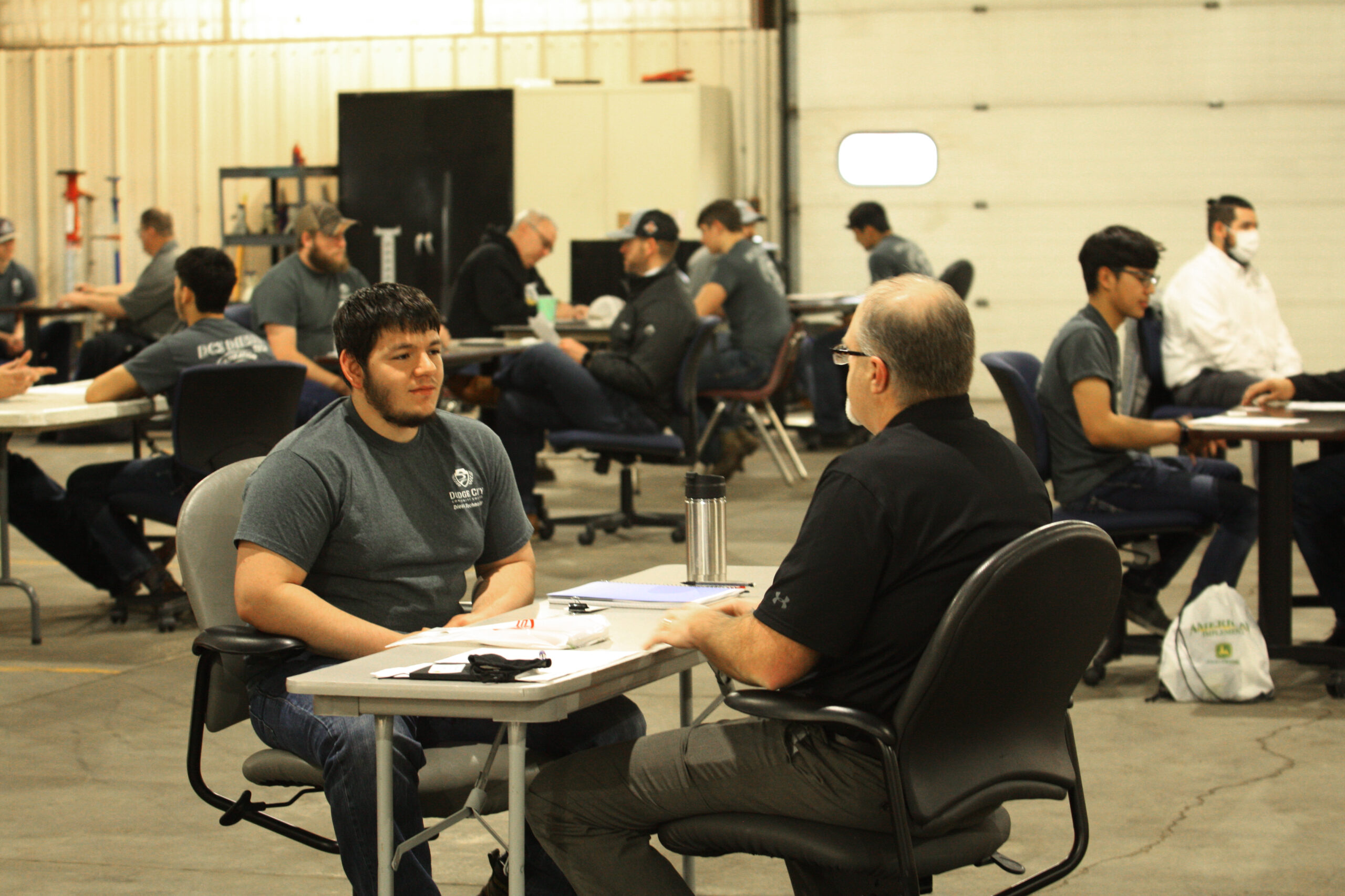 DC3 diesel tech students meet with recruiters during the college’s Reverse Career Fair on Wednesday, March 24. [Photo by Justin Wilson]