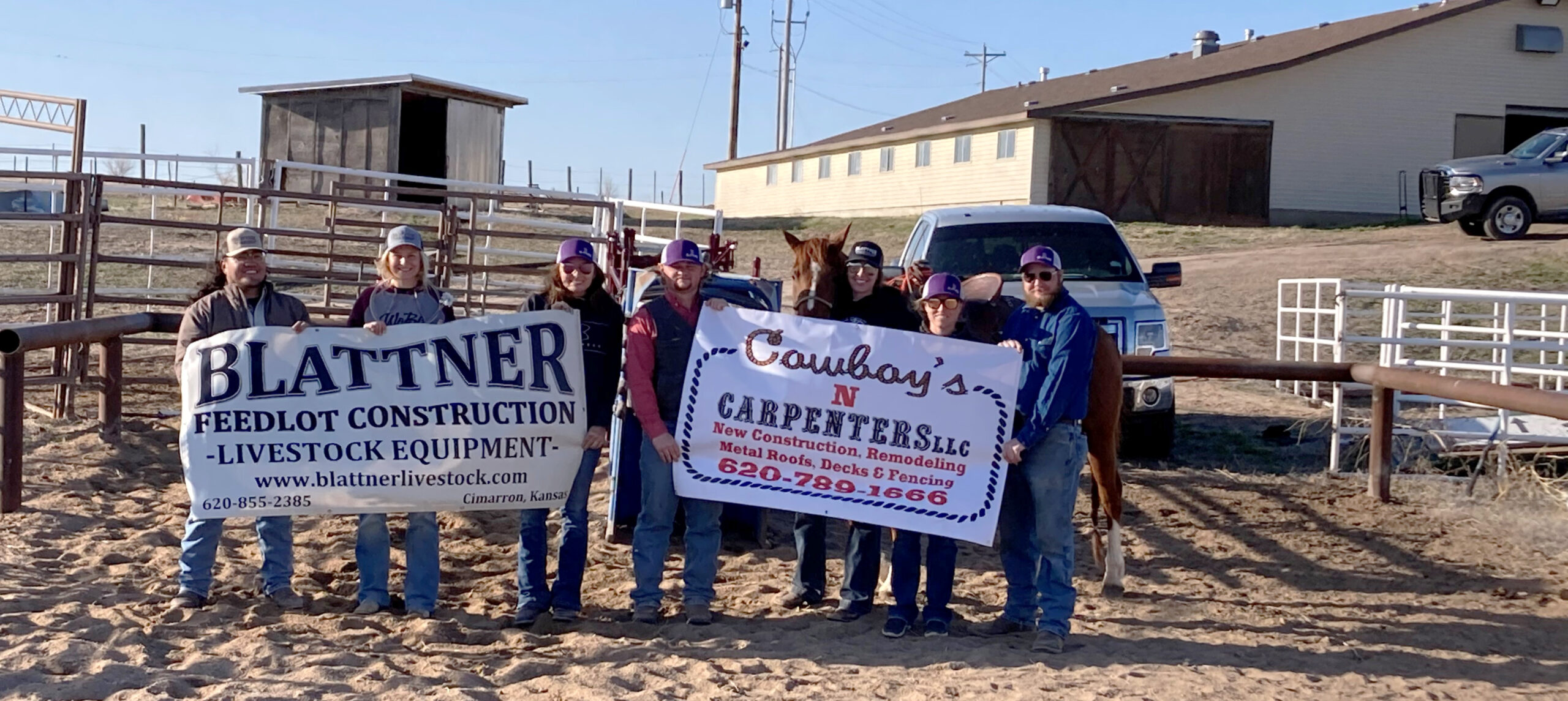 Members of the DC3 rodeo team pose with banners representing two of the three donors who provided the new roping boxes at the DC3 Rodeo Practice Arena. The area businesses involved with the project were Blattner Feedlot Construction & Livestock Equipment, Cowboys ‘N’ Carpenters LLC and Mead Lumber. [Photo by Tyrel Moffitt].